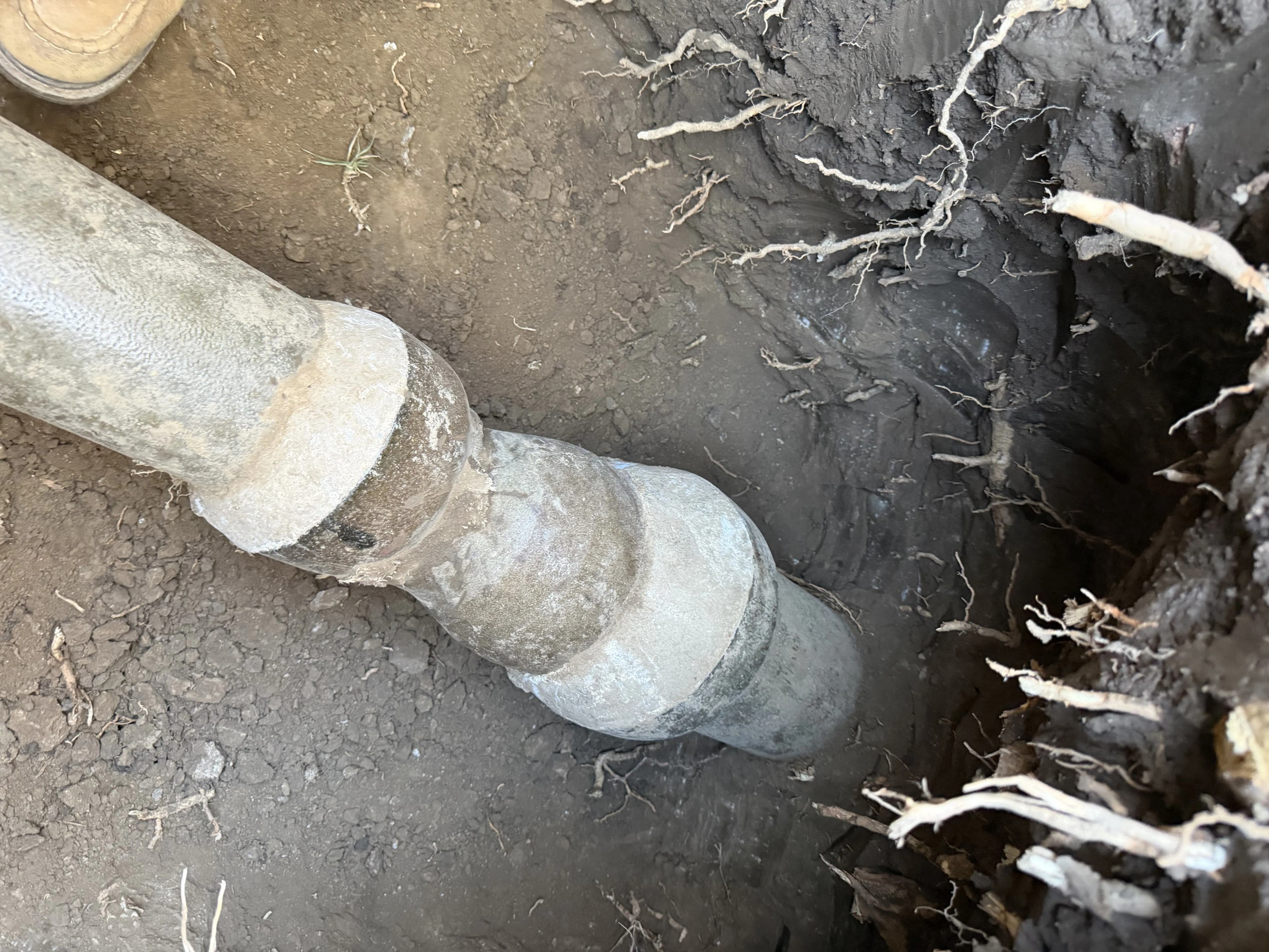 Glendale sewer line before repair showing cracked clay pipe and soil exposure