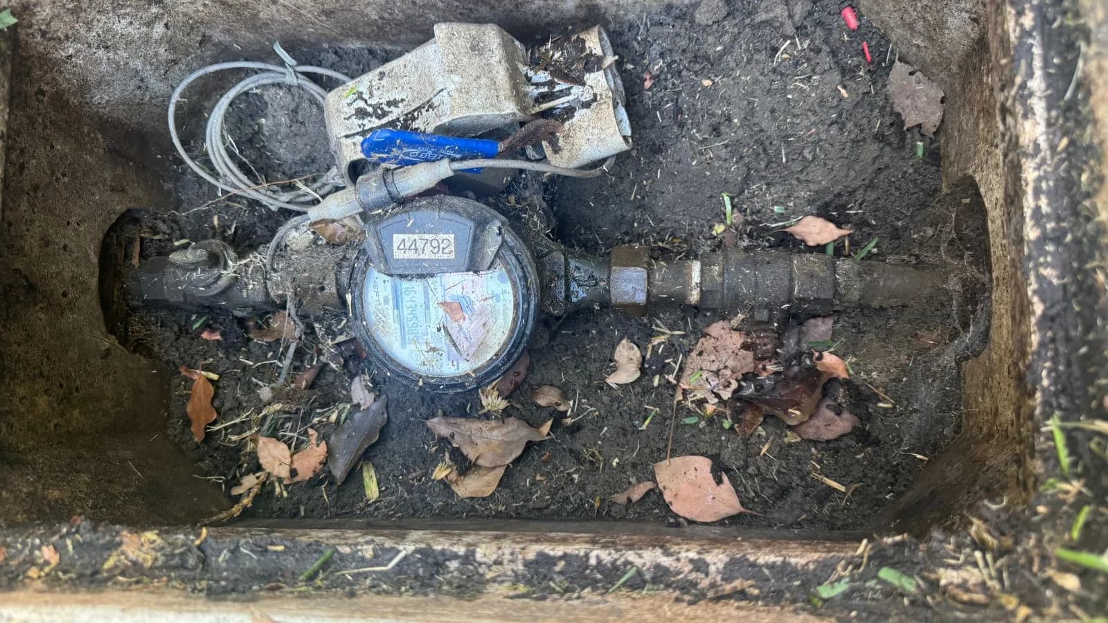 Glendale water line before repair – exposed corroded shutoff and damaged piping